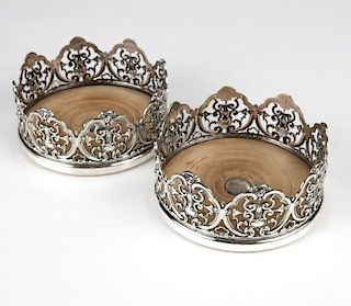 A pair of English silver plate wine coasters