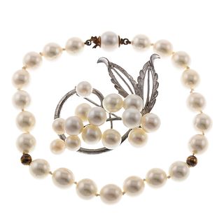 An 18K Pearl Bracelet & Sterling Pearl Brooch