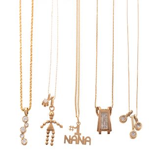 An Assortment of Chains & Diamond Pendants in Gold