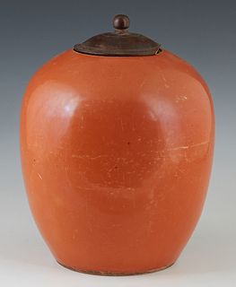 Chinese Orange Porcelain Baluster Jar, late 19th c., now with a carved wooden lid, H.- 10 3/4 in., Dia.- 8 in.