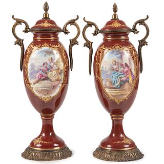 A Pair of French Hand-Painted Porcelain Urns with Metal Mounts