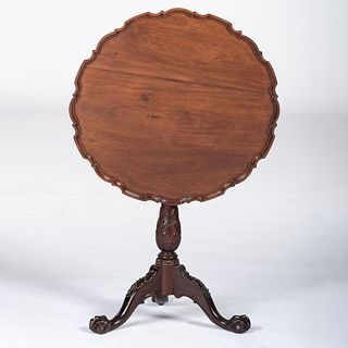 A Chippendale Mahogany Pie Crust Tea Table with Ball and Claw Feet
