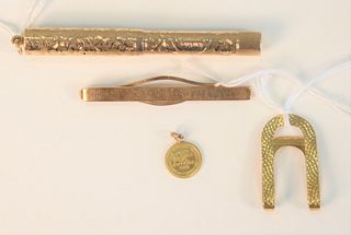 Four piece lot to include; 
14 Karat Gold Fountain Pen
length 3 5/8 inches, total weight 14.9 grams; 
Cartier 18 Karat gold tie clip
#336, 7 grams; 
B