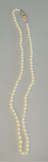Single strand of pearls with large 18K white and yellow gold clasp set with citrine and diamonds, length 28 inches
