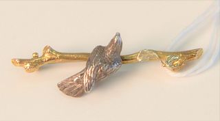 Gold Pin 
in form of a branch mounted with bird
length 1 1/2"
3.7 grams