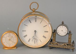 Three Small Travel Size Clocks
to include Jaeger 8 day, bronze column clock with enameled dial and a brass and glass round clock