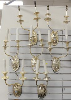 Group of Seven Caldwell Two Light Sconces
having silver finish with scrolled candle arm
marked with "C" inside a diamond or lozenge
height 16 inches
P