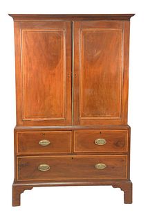 Mahogany Linen Press 
in two parts, on bracket feet
late 18th Century
height 74 1/2 inches, width 44 1/2 inches