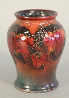 Moorcroft Vase
red glazed with leaves and fruit design
Pattern to the Queen, written on bottom
height 4 1/4 inches
Provenance: Thirty-five year collec