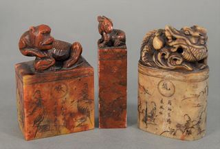 Three Soapstone Carved Seals
each with animals on top and carved designs, two are signed
heights: 3, 3 1/4, 3 1/4 inches
