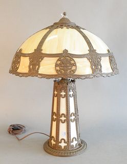 Slag Glass Table Lamp
having six carmel glass panels with round light up base
height 23 inches, diameter 17 1/2 inches
Provenance: Thirty-five year co