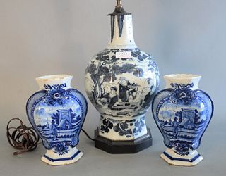 Three Delft Blue and White Pieces
to include large vase, made into a table lamp, having Oriental motif, along with pair of garniture vases
vase height