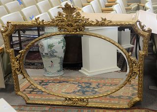 Large Gilt Decorated Mirror
with plume top
height 46 inches, width 60 inches
(repair to top)