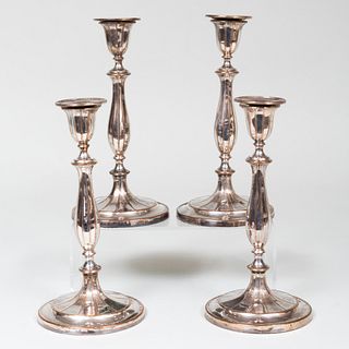 Set of Four Sheffield Plate Candle Sticks with Circular Bases