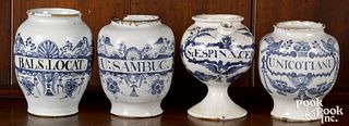 Four Delft blue and white apothecary bottles