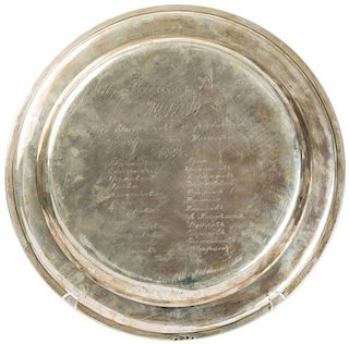 A SILVER CHARGER PLATE PRESENTED TO THE IMPERIAL MEDIC L. F. RAGOZIN BY THE ACTORS AND STAFF OF THE ALEXANDRINSKY THEATER, HENRIK HACKLIN, ST. PETERSB