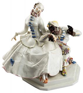 A PORCELAIN GROUP OF A LADY WITH A MOOR, MEISSEN, AFTER A MODEL BY PAUL SCHEURICH