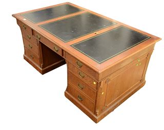 Large Cherry Partners Desk in three parts, with three leather top sectionsheight 31 inches, top 42" x 74"Provenance: The Estate of Diana Atwood Joh