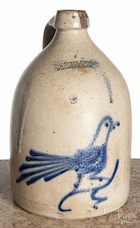 New York stoneware jug, 19th c., impressed Whites Utica, with a cobalt bird, 12'' h.