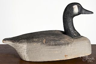 Herters carved and painted goose decoy, mid 20th c., 18'' l.