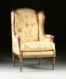 A LOUIS XVI STYLE GILTWOOD AND SCALAMANDRÉ UPHOLSTERED BERGÈRE A L'OREILLES, EARLY 20TH CENTURY,