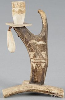 Carved antler candlestick, 20th c., with a Native American teepee carved on the support, 6'' h.