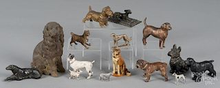 Fifteen metal dogs, 19th/20th c., to include cast iron and spelter examples, largest - 5'' h.