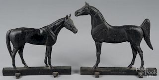 Two cast iron Virginia Metalcrafters horse doorstops, copyright 1938 and 1949