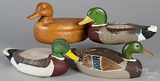 Four carved duck decoys, signed Bob Wohlson, 20th c., largest - 15 3/4''.
