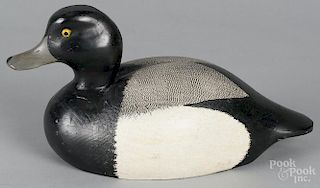 Carved and painted bluebill duck decoy, mid 20th c., 14'' l.