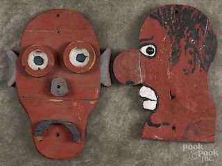 Two carved and painted carnival faces, mid 20th c., 10 1/4'' h. and 11 1/2'' h.