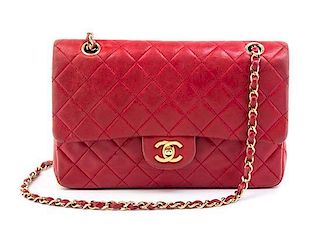 A Chanel Red Quilted Leather Double Flap Handbag, 10" x 7" x 3".