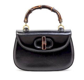 A Gucci Black Leather Bamboo Top Handle Handbag, 10.5" x 7" x 3".
