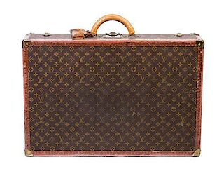 * A Louis Vuitton Hardsided Suitcase, 27.5" x 18.5" x 7".
