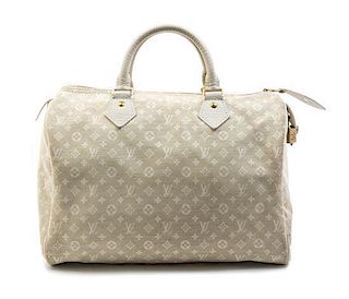 A Louis Vuitton Ivory Canvas Monogram Speedy Handbag,