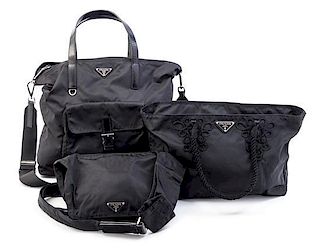 A Group of Three Prada Black Nylon Handbags, 8" x 7" 1.5"; 15.5" x 9" x 4.5"; 16" x 12.5" x 4.5".