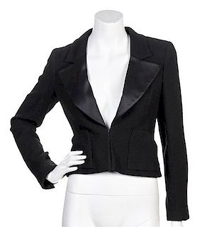 * A Chanel Black Boucle and Satin Lapel Jacket, Size 36.