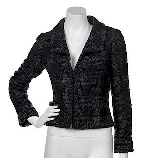 * A Chanel Black and Grey Boucle Jacket, Size 36.