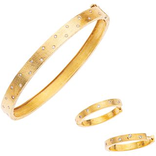 SET OF BRACELET AND PAIR OF EARRINGS WITH DIAMONDS IN 18K YELLOW GOLD Bracelet with box clasp and 8-shaped safety.