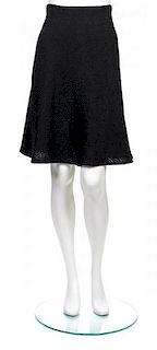* A Chanel Black Wool Boucle Flared Skirt, Size 34.