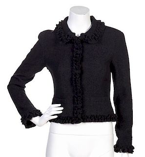 * A Chanel Black Wool Ruffle Boucle Jacket, Size 38.