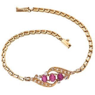 14K YELLOW GOLD BRACELET WITH RUBIES AND DIAMONDS Box clasp with 8-shaped safety. Weight: 7.5 g. Length: 7.5" (19.2 cm)