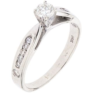 RING WITH DIAMONDS IN 14K WHITE GOLD Weight: 2.3 g. Size: 6 1 Brilliant cut diamond ~ 0.20 ct Clarity:...