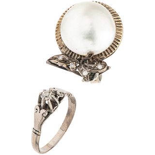 TWO RINGS WITH HALF PEARL AND DIAMONDS IN PALLADIUM SILVER Show wear. Sizes 7 and 8 Total weight: 10.7 g