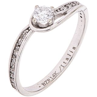 RING WITH DIAMONDS IN 14K WHITE GOLD Weight: 1.6 g. Size: 7 1 Brilliant cut diamond ~ 0.16 ct 20 Diamond ...