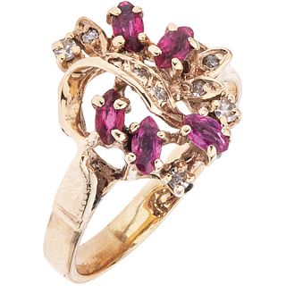   RING WITH RUBIES AND DIAMONDS IN 10K YELLOW GOLD Weight: 3.9 g. Size: 7 ¼ 5 Rubies marquise cut ~ 0.35 ct