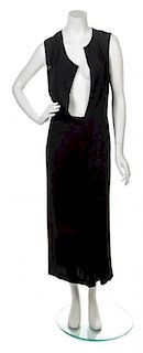A Comme des Garcons Black Dress, Size M.