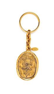 * A Chanel Goldtone Oval Key Chain,