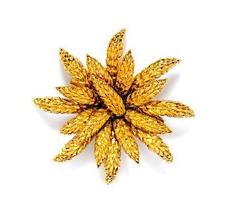 * A Chanel Goldtone Floral Brooch, 3.5" x 3.5".