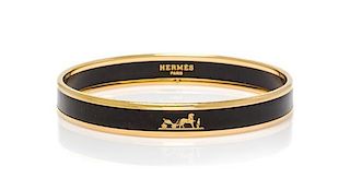 An Hermes Caleche Narrow Printed Enamel Bracelet, .05" wide, 2.5" diameter.